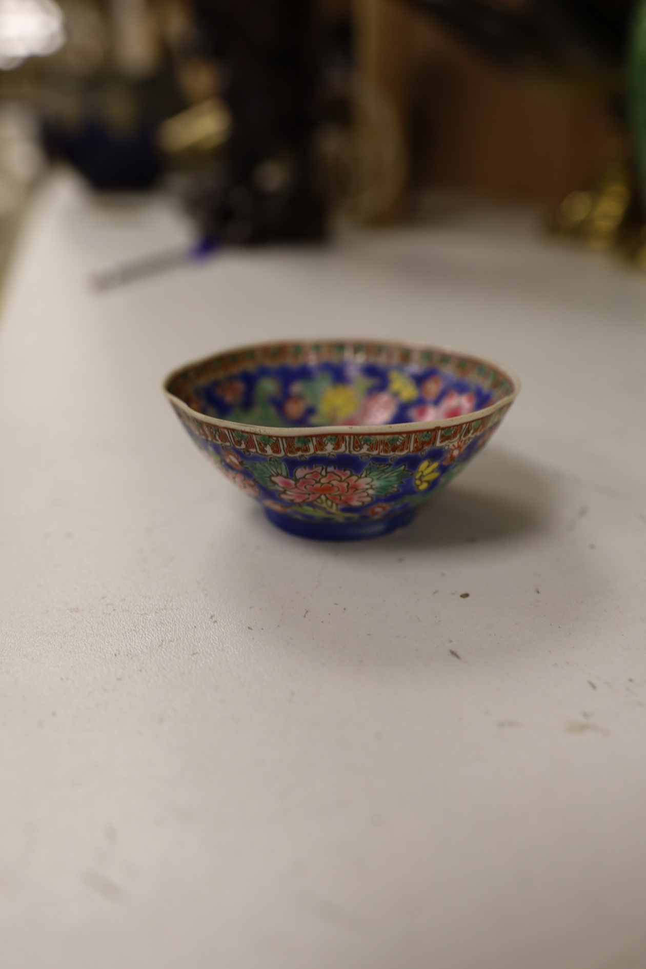 A pair of Chinese enamelled porcelain bowls, an eggshell bowl and a blue and white dragon bowl, turquoise bowls 11cm diameter (4). Condition - fair